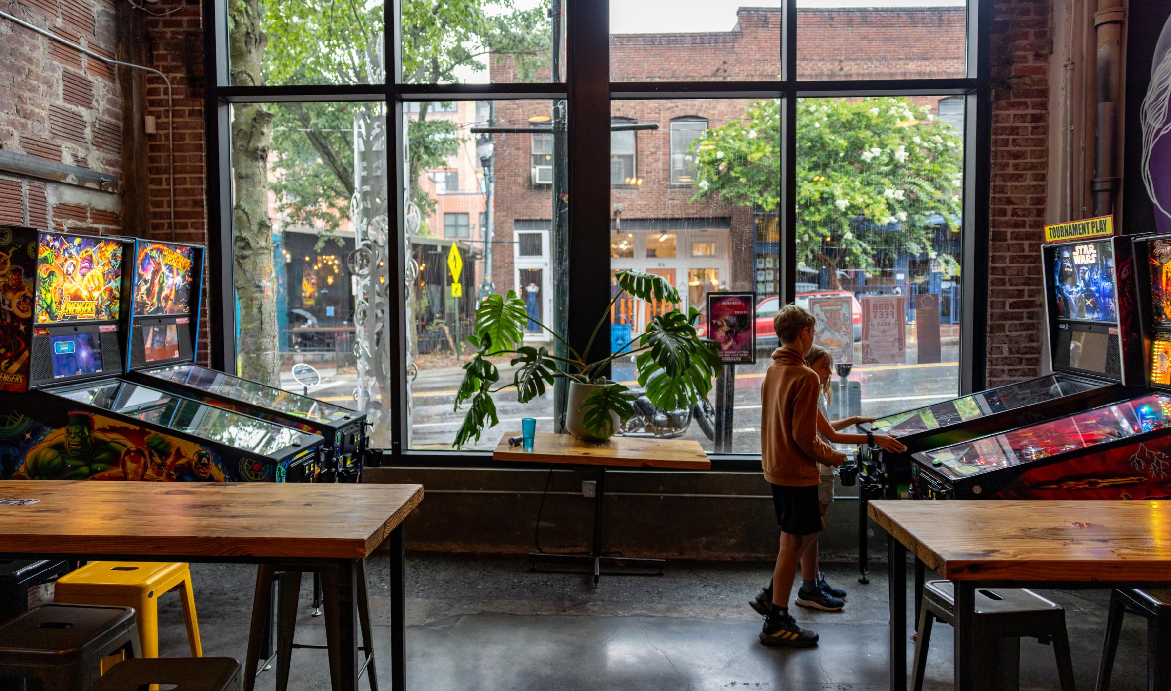 Dylan and Josie play some Pinball while the rest of us enjoy some fine beverages at DSSOLVR Brewery - Asheville, NC