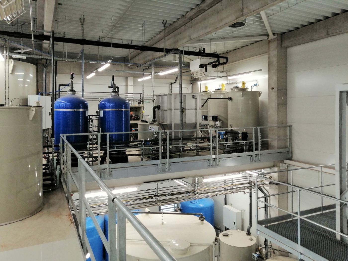 Sand filters, dosing tanks and pipework in the treatment hall at Volta Energy, Tatabánya, Hungary
