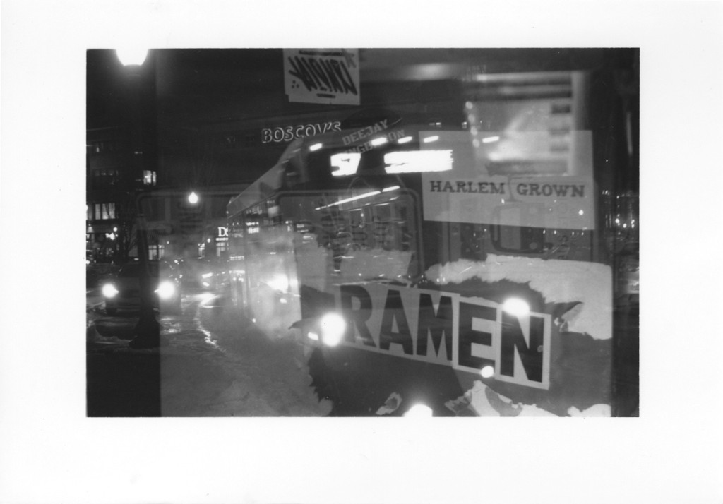 two cell phones on a gray surface