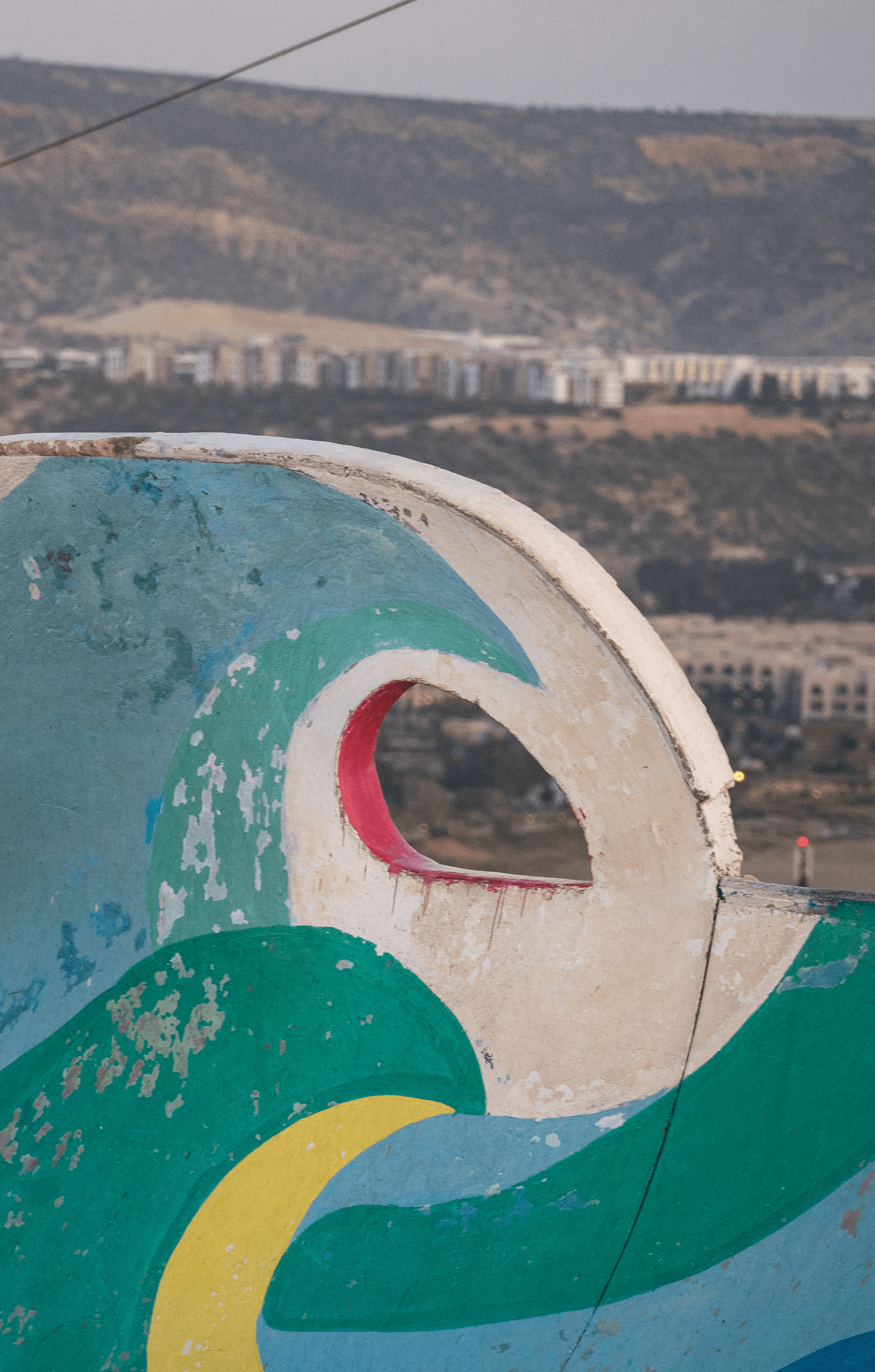 Artist painting the Atlantic coastline near Taghazout