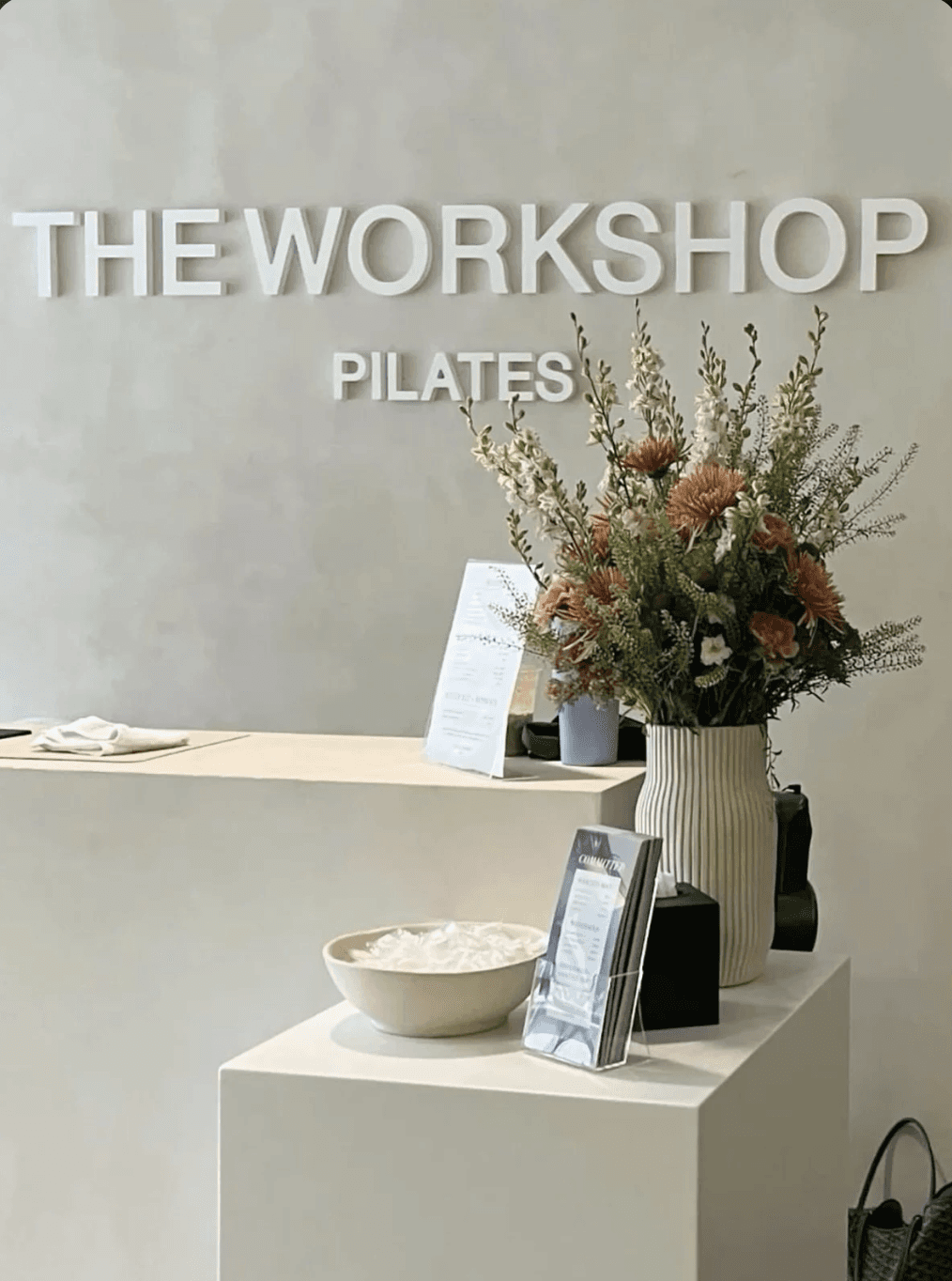 Metal Sign called Sculpt Club Pilates Studio in reception 