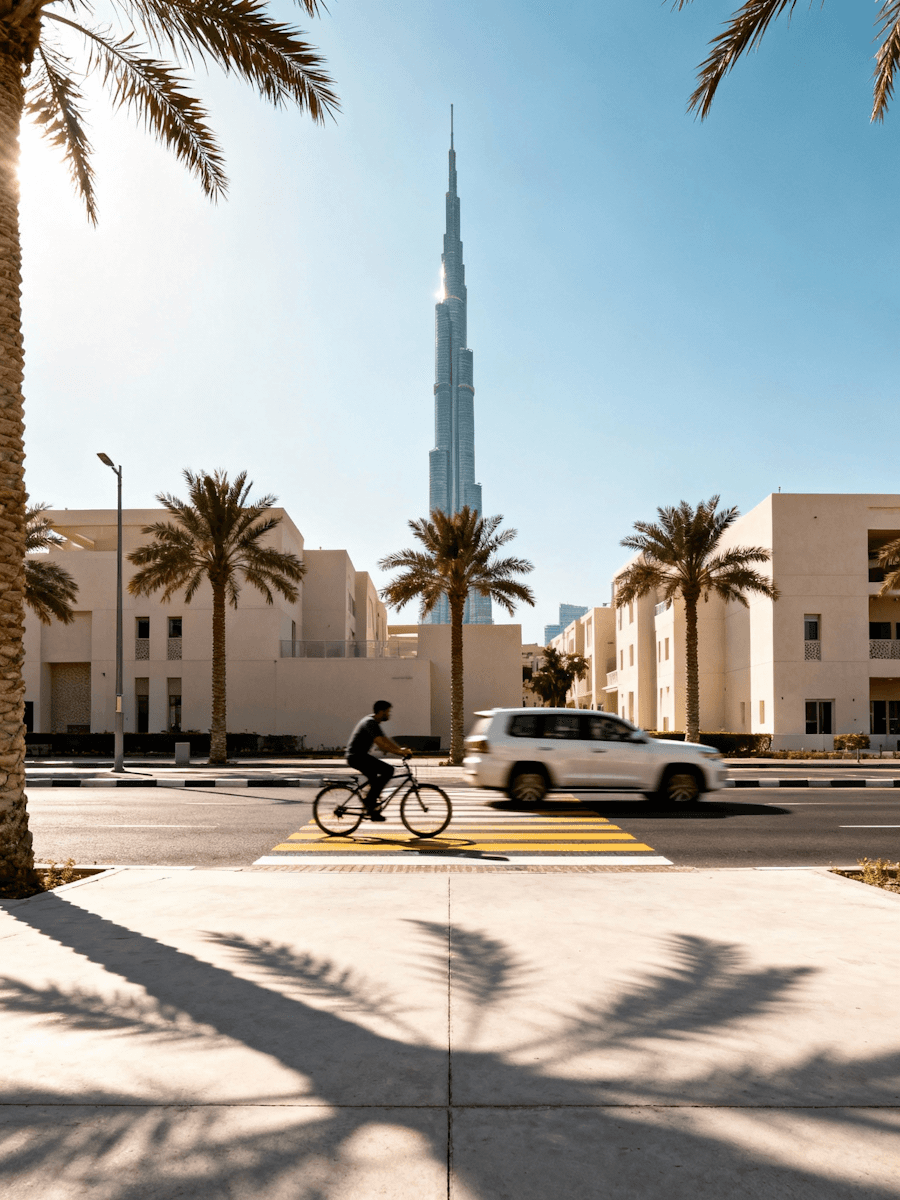 Modern Middle Eastern boulevard with landmark skyline backdrop