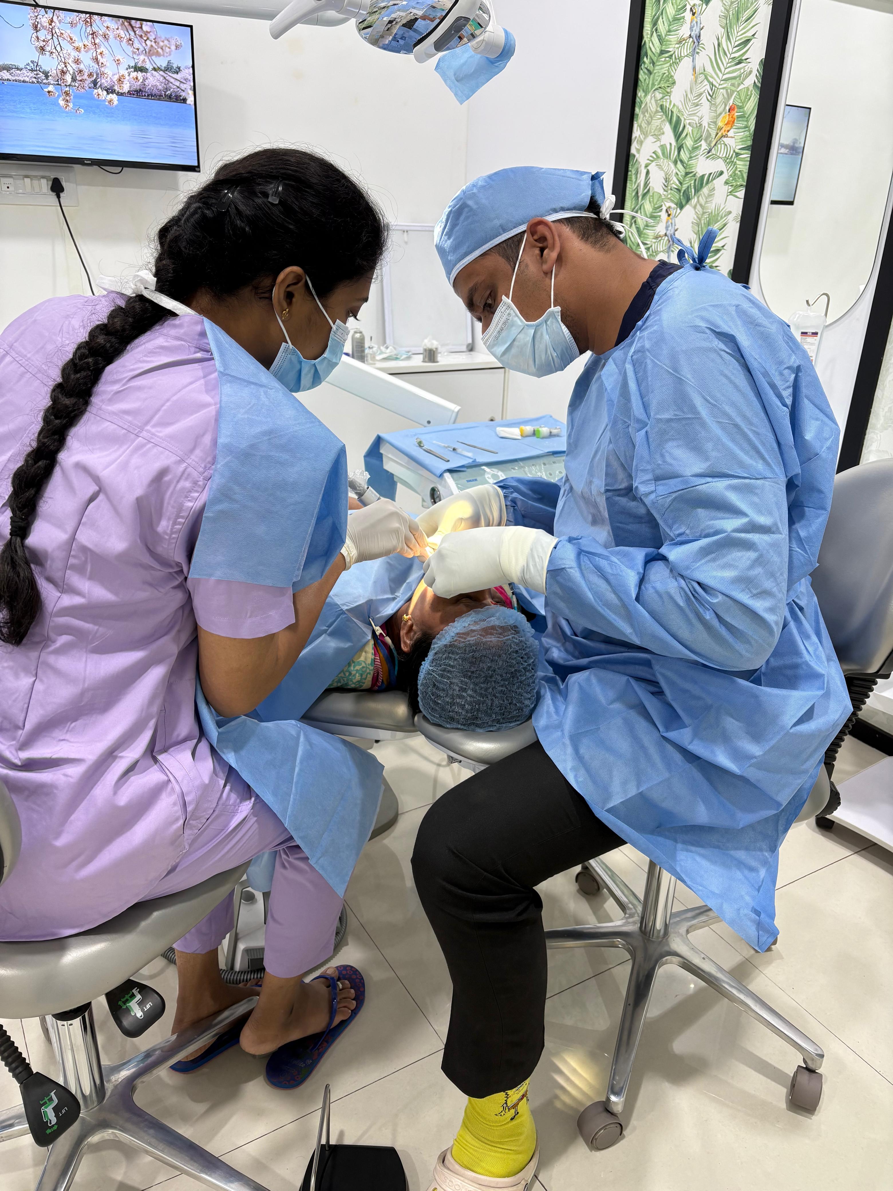 boy in blue long sleeve shirt drinking from a feeding bottle