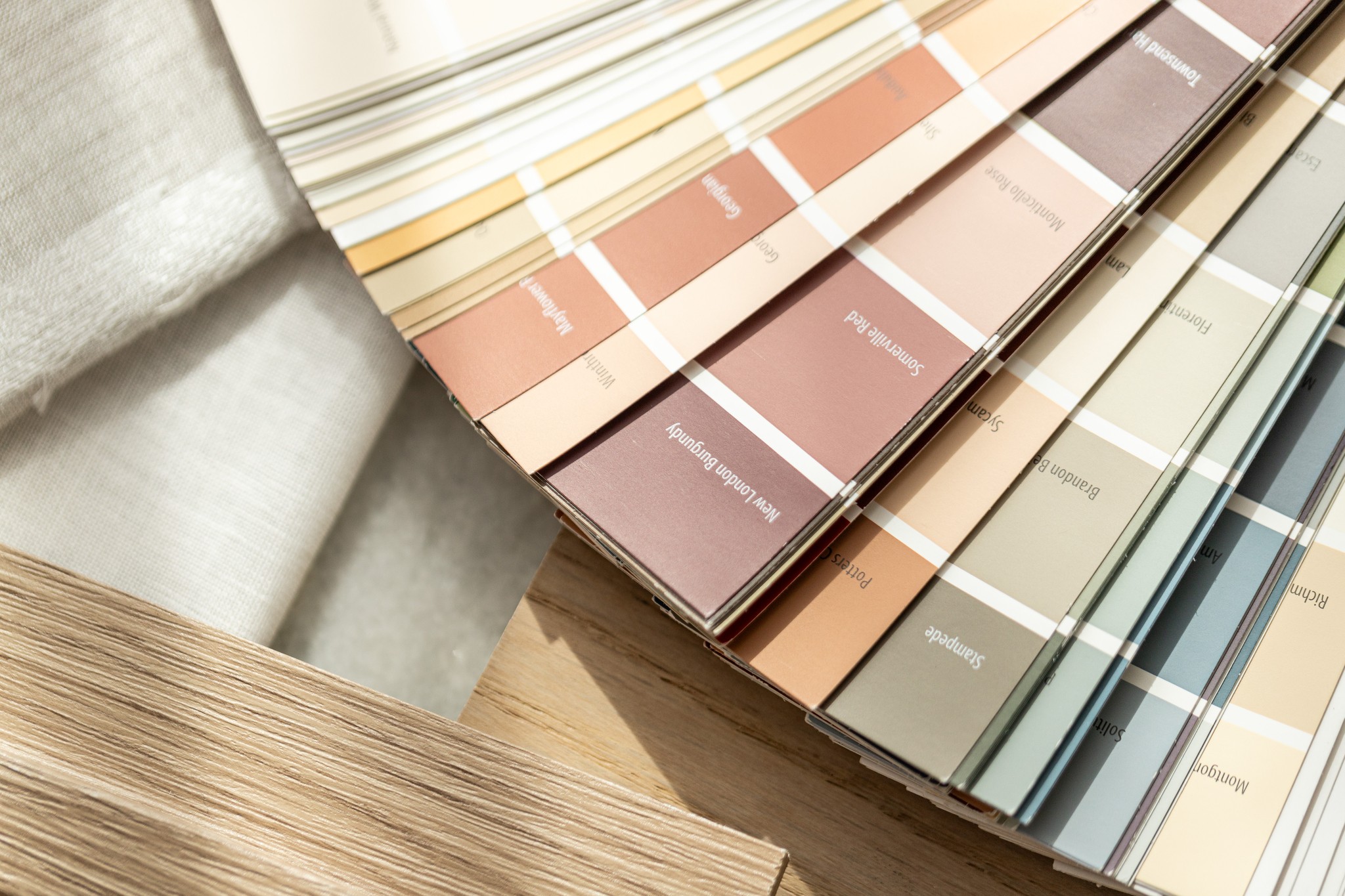 Image of Color swatches and fabric samples for interior design and home renovations by KHD Homes.