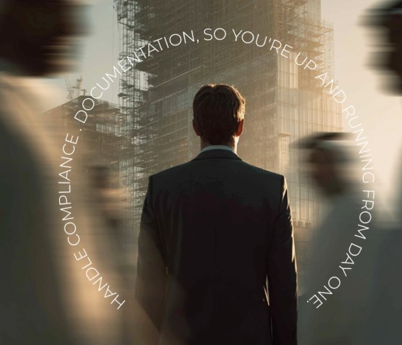 Conceptual image of a businessman facing a city skyline. White text reads: 'HANDLE COMPLIANCE . DOCUMENTATION, SO YOU'RE UP AND RUNNING FROM DAY ONE.