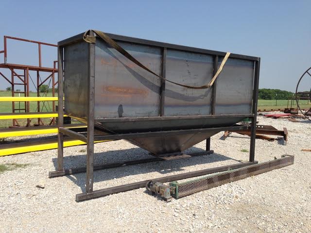 This is a large metal hopper built with welded sheet metal and steel tubing.  It has a large opening at the top and a small opening at the bottom of the hopper. Our welding services and metal fabrication abilities are shown.