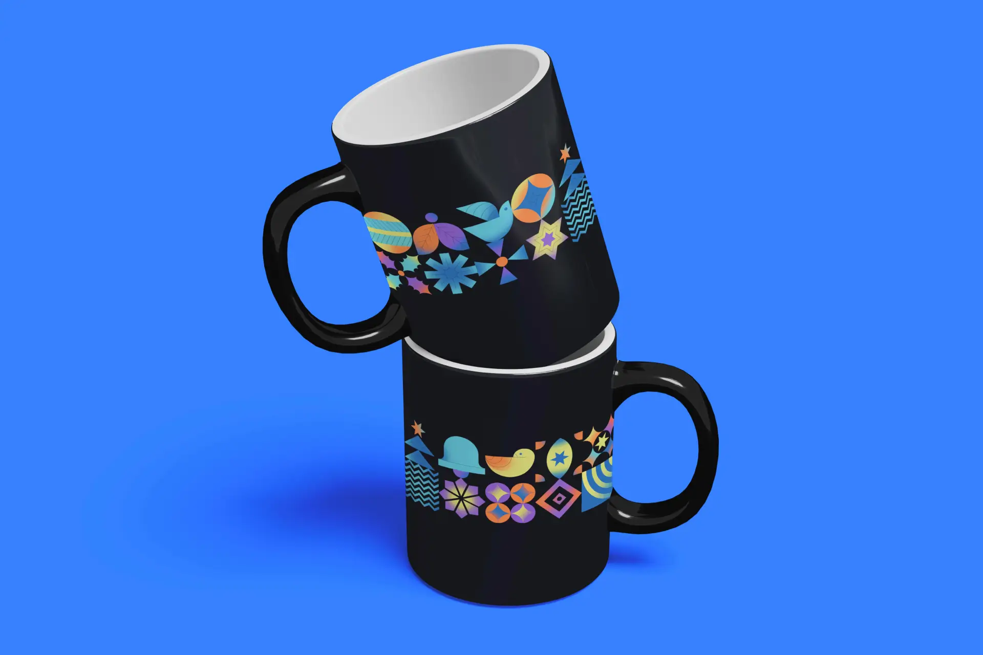 Two black mugs with colorful geometric and nature-inspired patterns, including birds and stars, stacked against a vibrant blue background.