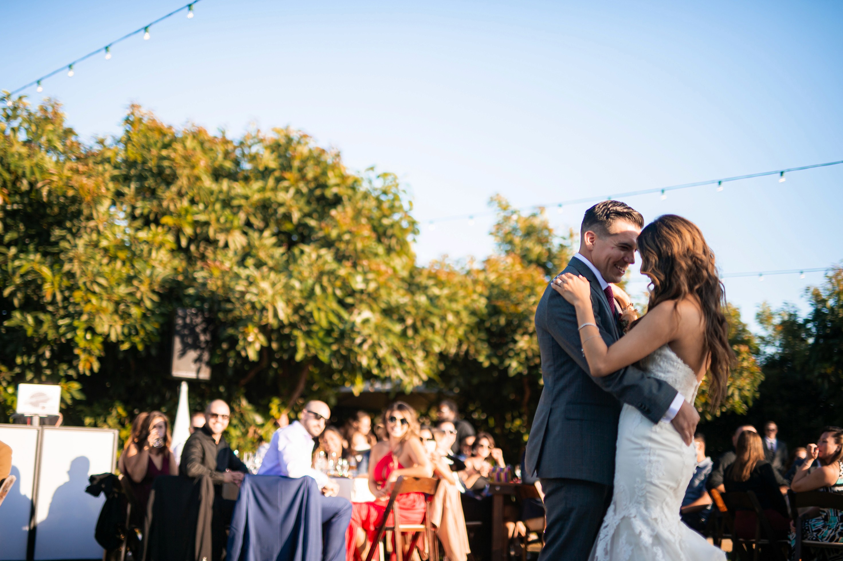 Flat lay wedding details with bouquet, rings, and sparkling bridal heels