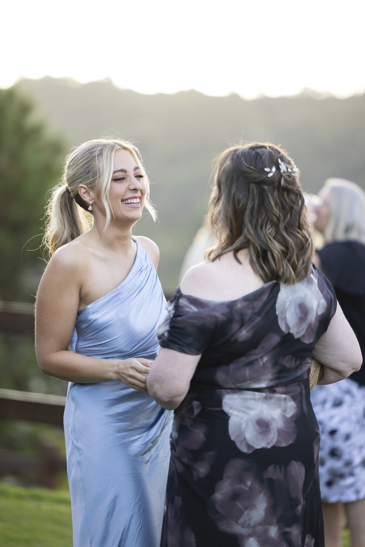 Two woman talking at wedding