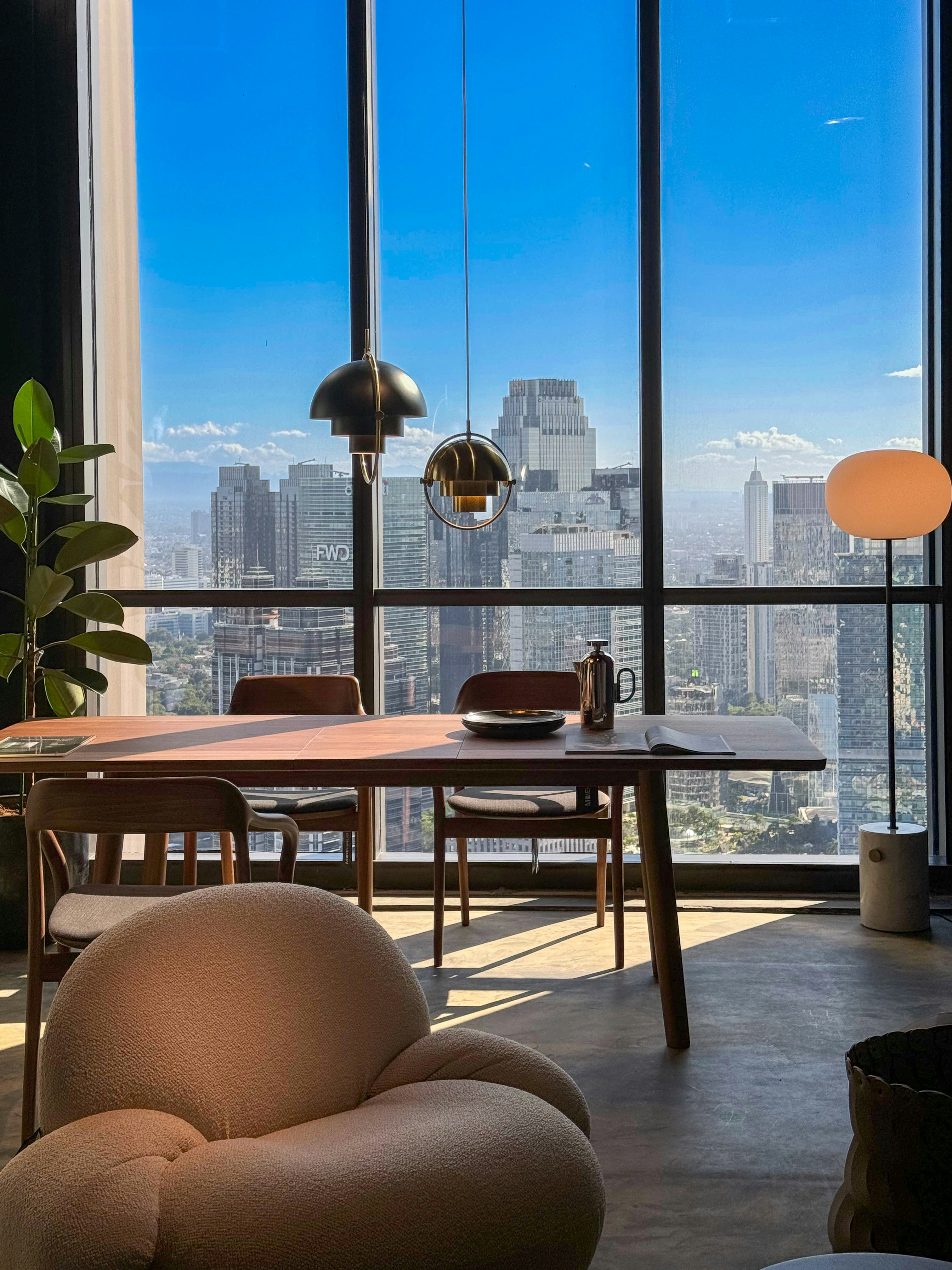 a living room filled with furniture and a large window