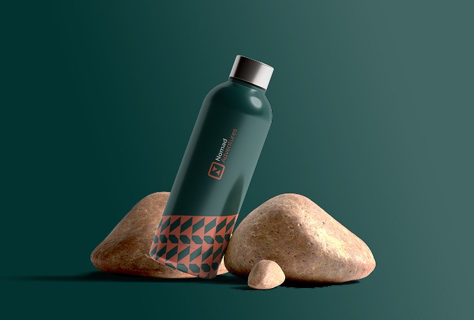 Interior view from living area toward the lake, large glass facade, minimal furniture.