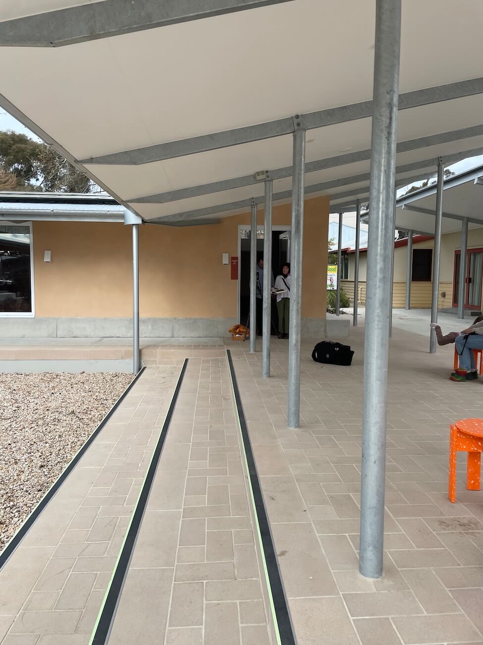 A photo shows the hallway to the house 