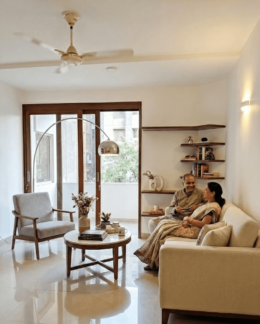 Shared Moments: The living area is designed as the heart of the home, where comfortable beige upholstery and warm lighting create an intimate setting for conversation and relaxation.