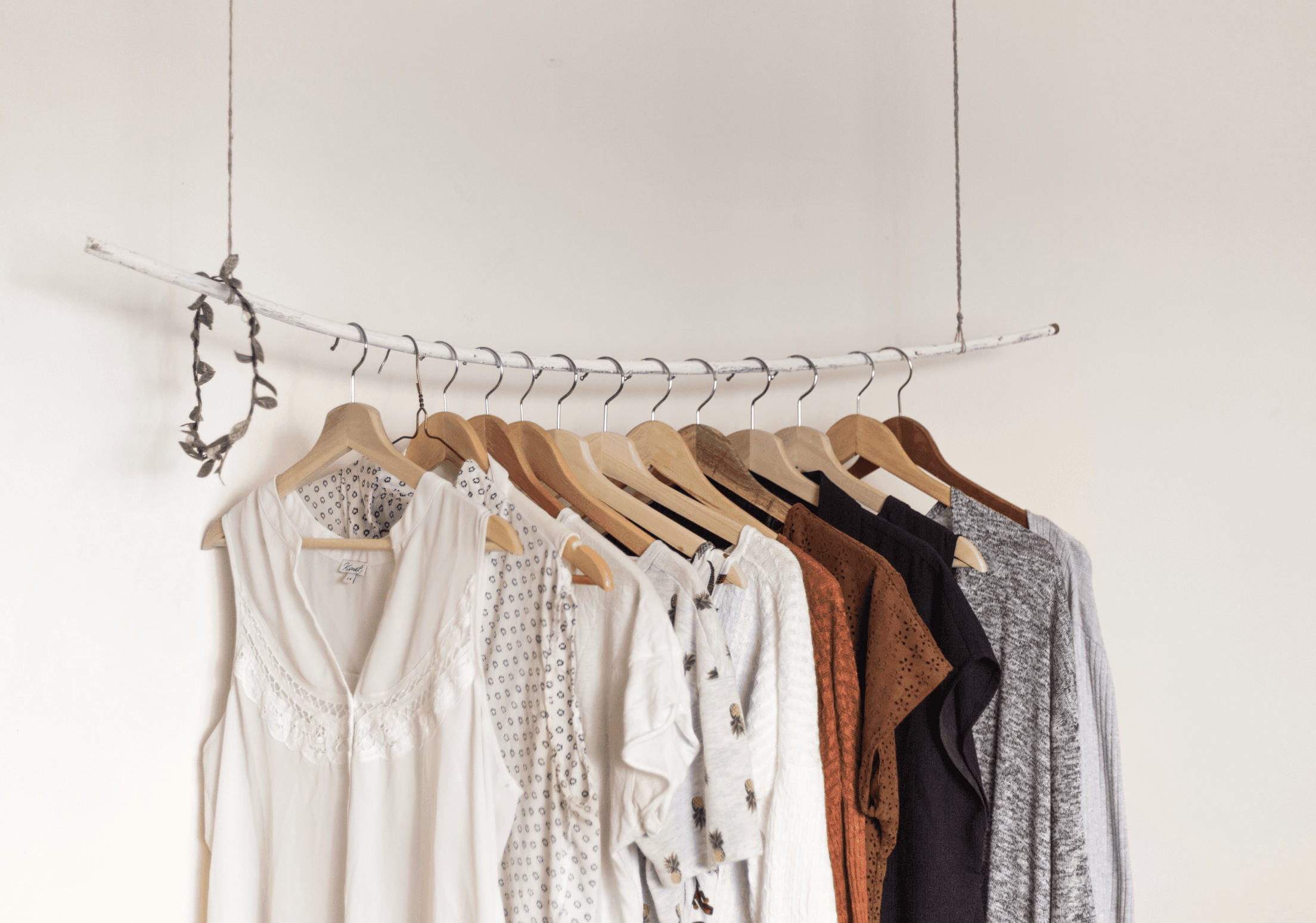 An image of clothes on a cloth rack