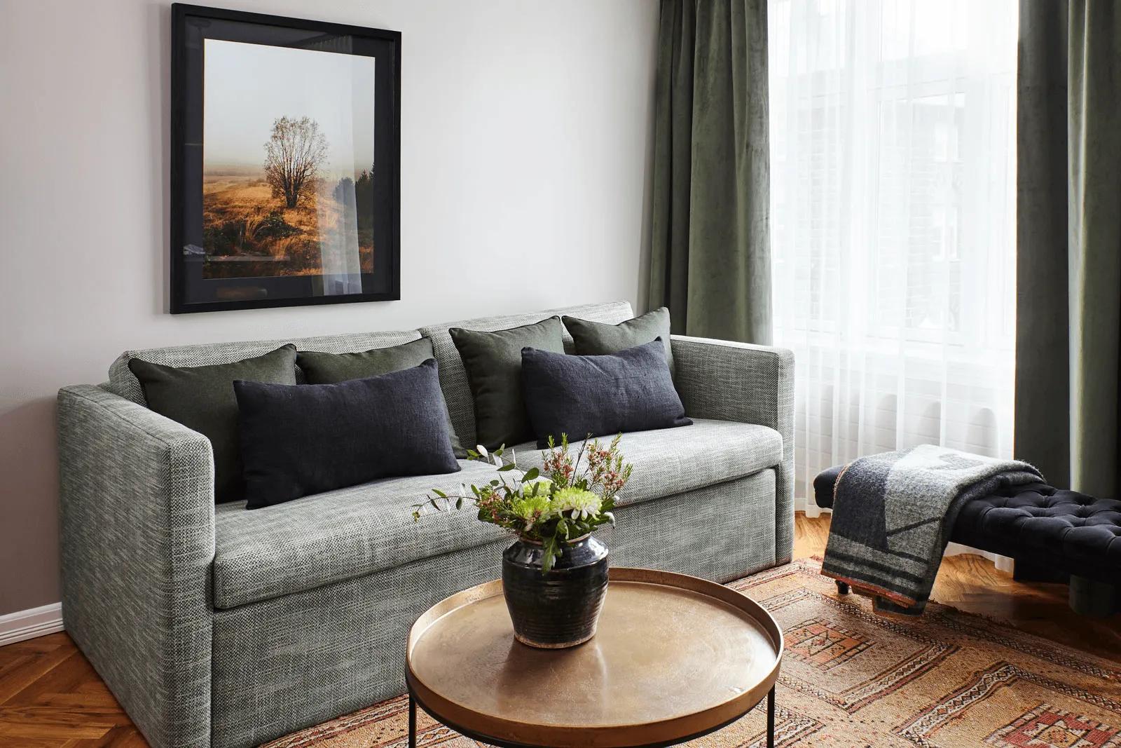interrior of living room with sofa and small table with houseplant