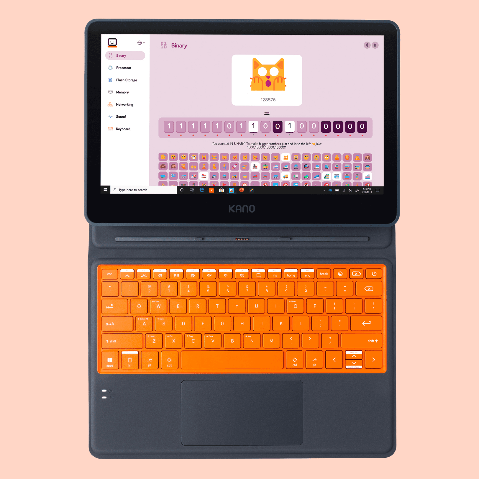 The Kano PC laid flat on a peach background. On the screen is a cat emoji, and beneath it are binary 1's and 0's demonstrating the code that is assigned to the emoji.