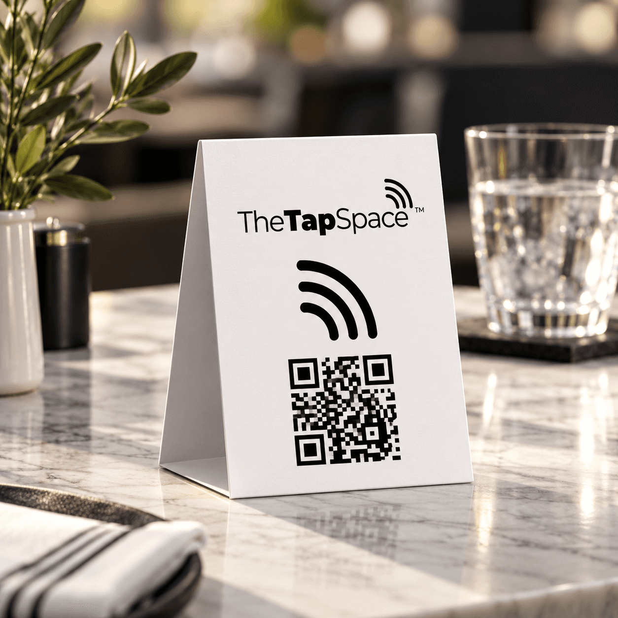White TapSpace NFC and QR tabletop tent in a cafe