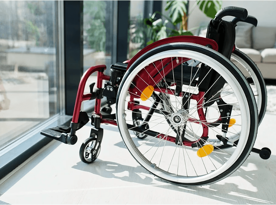 Wheelchair positioned in a residential space, representing paralysis injury and loss of mobility