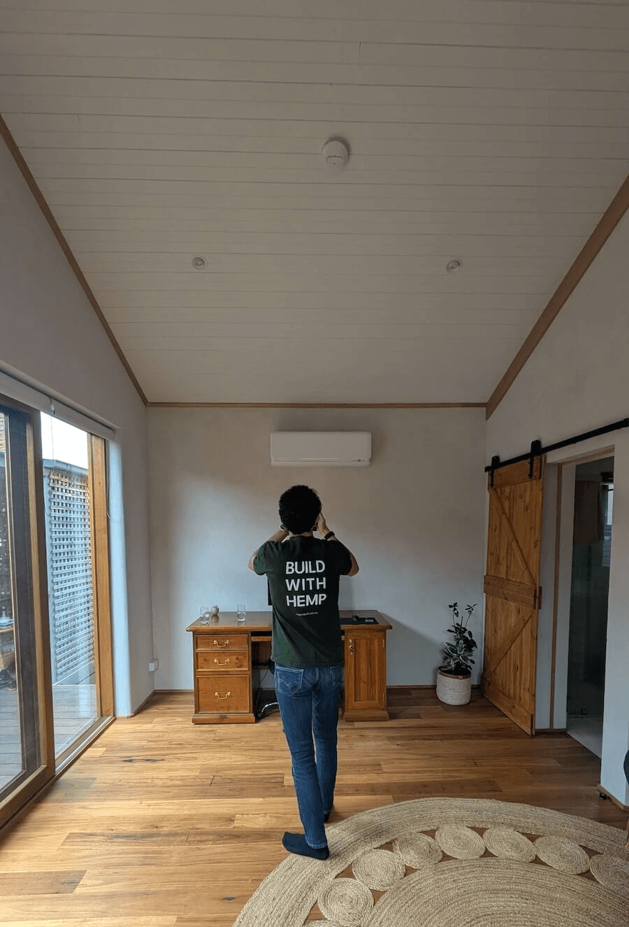 A photo shows the living area picturing the wall made in hempcrete blocks