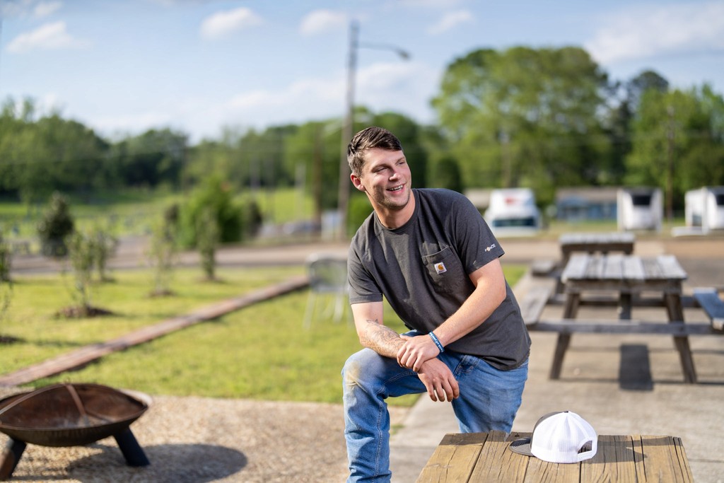 A waterfall surrounded by green grass