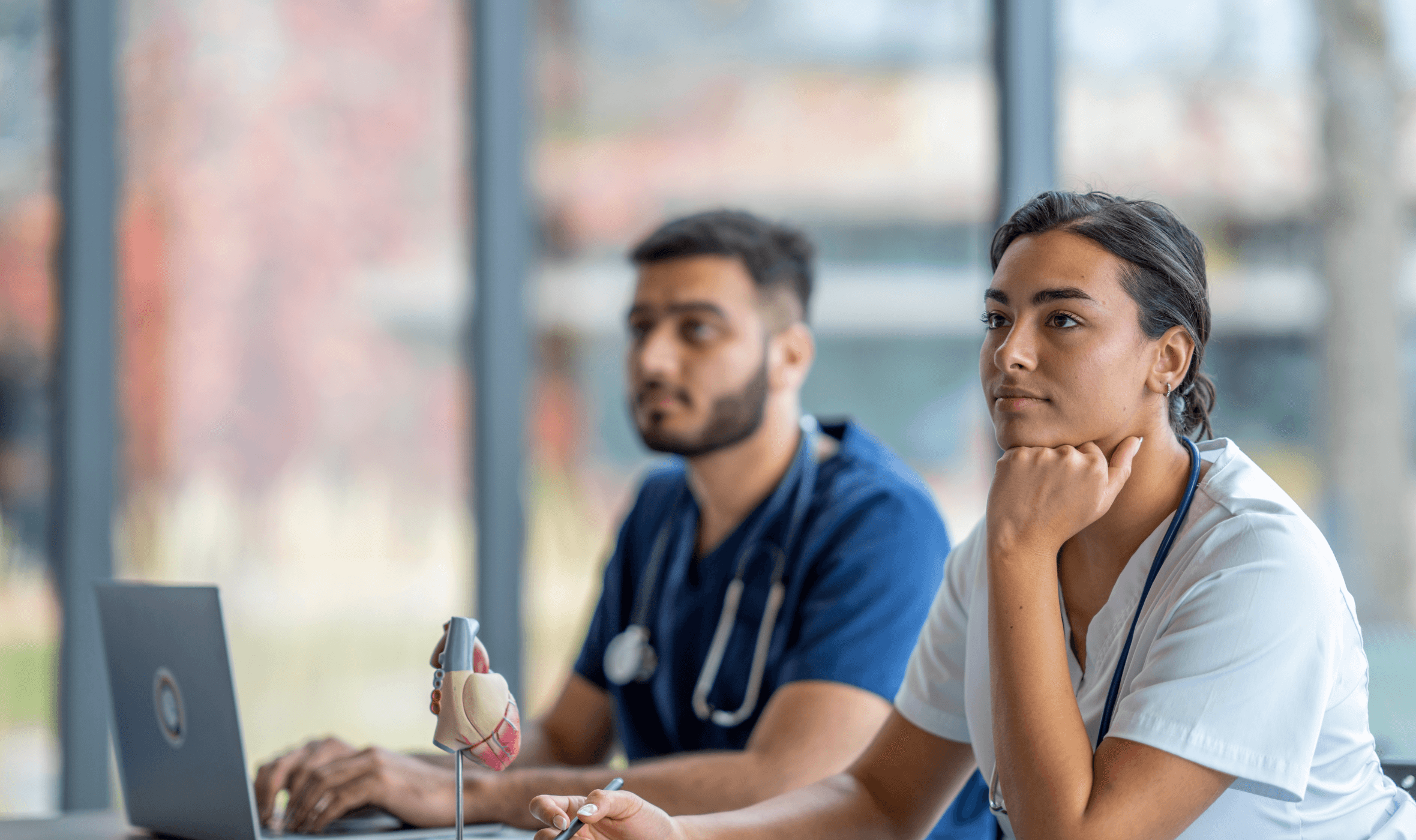 two medical students attending a healthcare cpd course