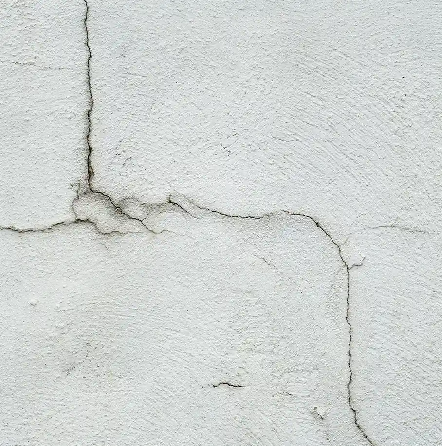 A photo of a waterproofing work truck hauling a Rub-R-Wall® trailer to a job site on an ocean harbor