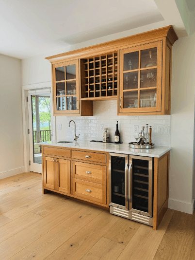 Kitchen bar area with shelves and wine cooler