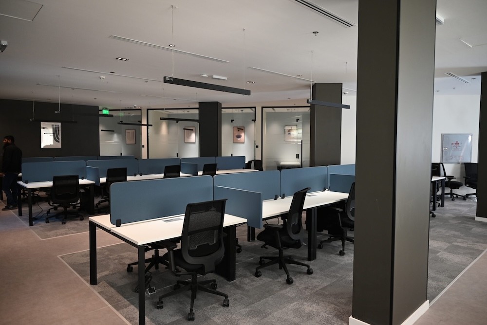 Open office workspace with shared desks at DIOM Black Garden headquarters in Riyadh