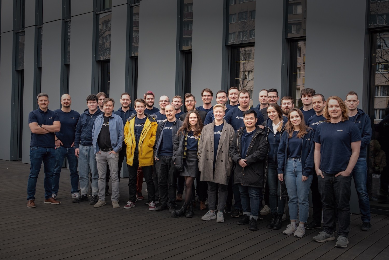 A photograph of an executive using CloudControl by signageOS to monitor and control digital signage devices