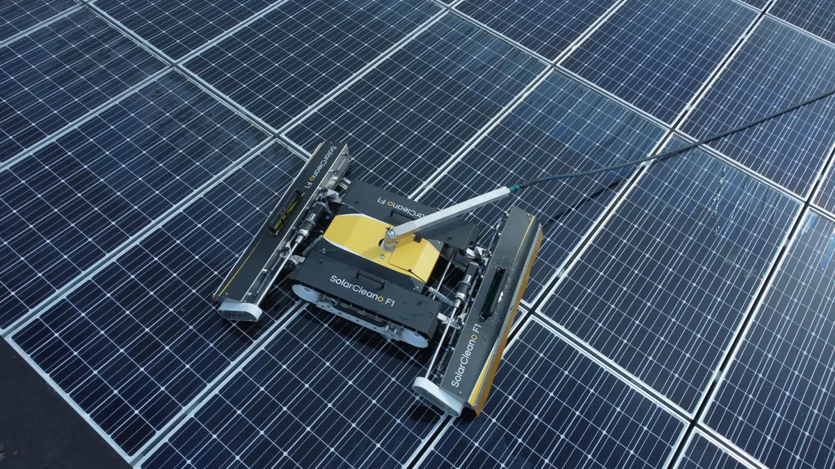 Yellow solar cleaning robot on a rooftop array at Pleasanton Park in Pleasanton, CA