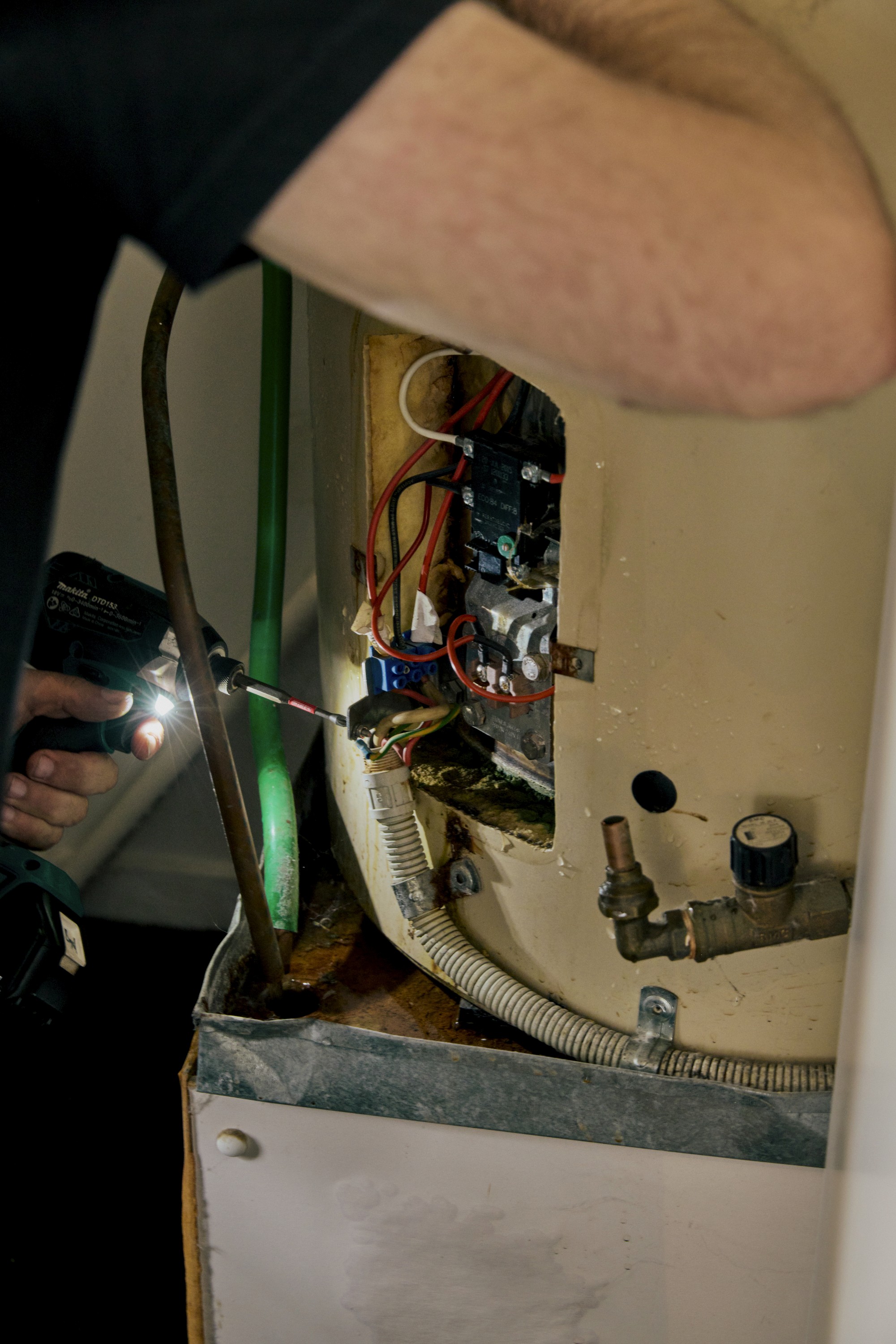 Good Maintenance Electrician Disconnecting Old Hot Water Unit