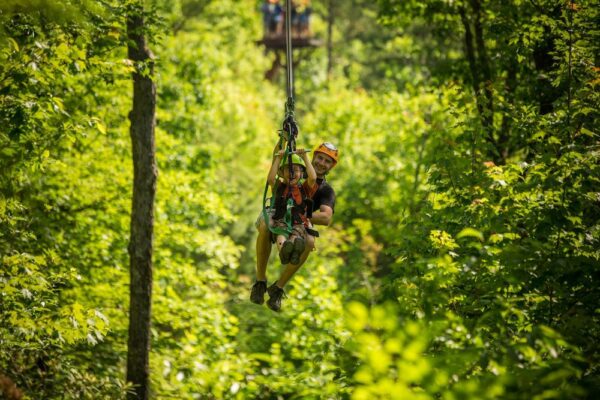 dad and son ziplining in gatlinburg