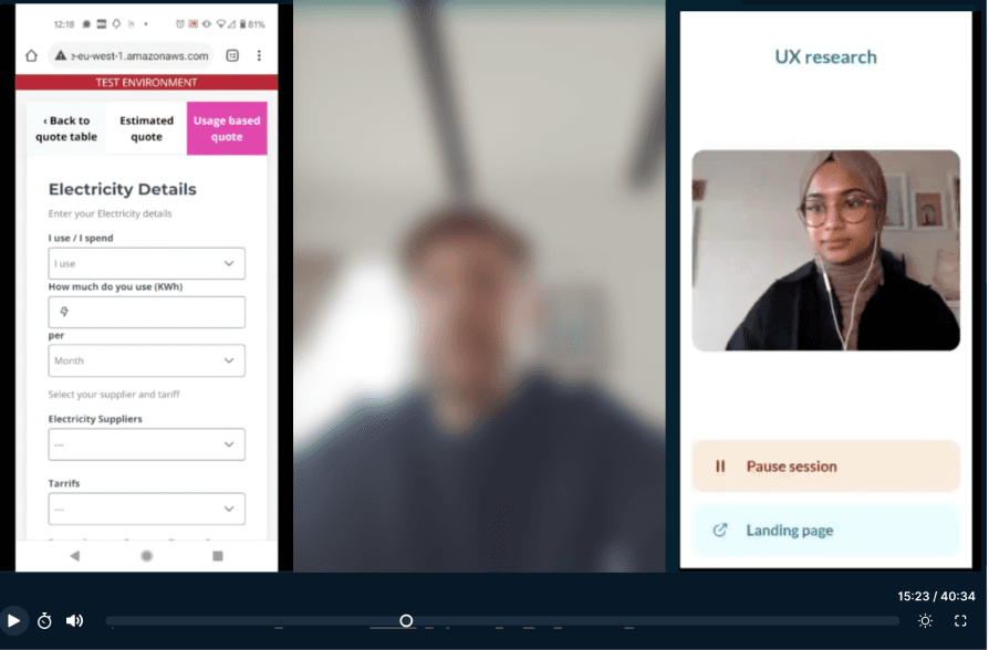People in a warehouse aisle, with products stocked to the left and order crates on the right ready for customer orders