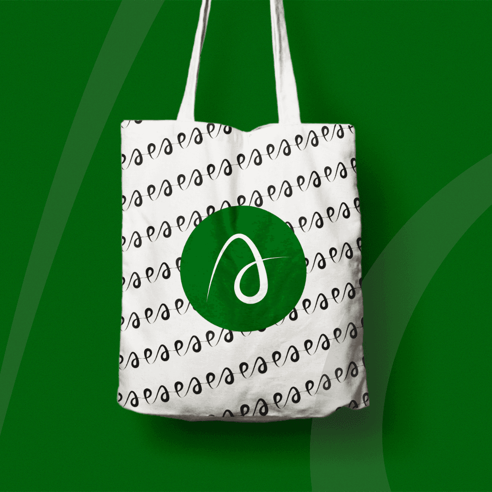 Culturally inspired tote bag packaging and brand design for Ade Fashion World Modern African fashion branding with earthy tones and handcrafted symbols