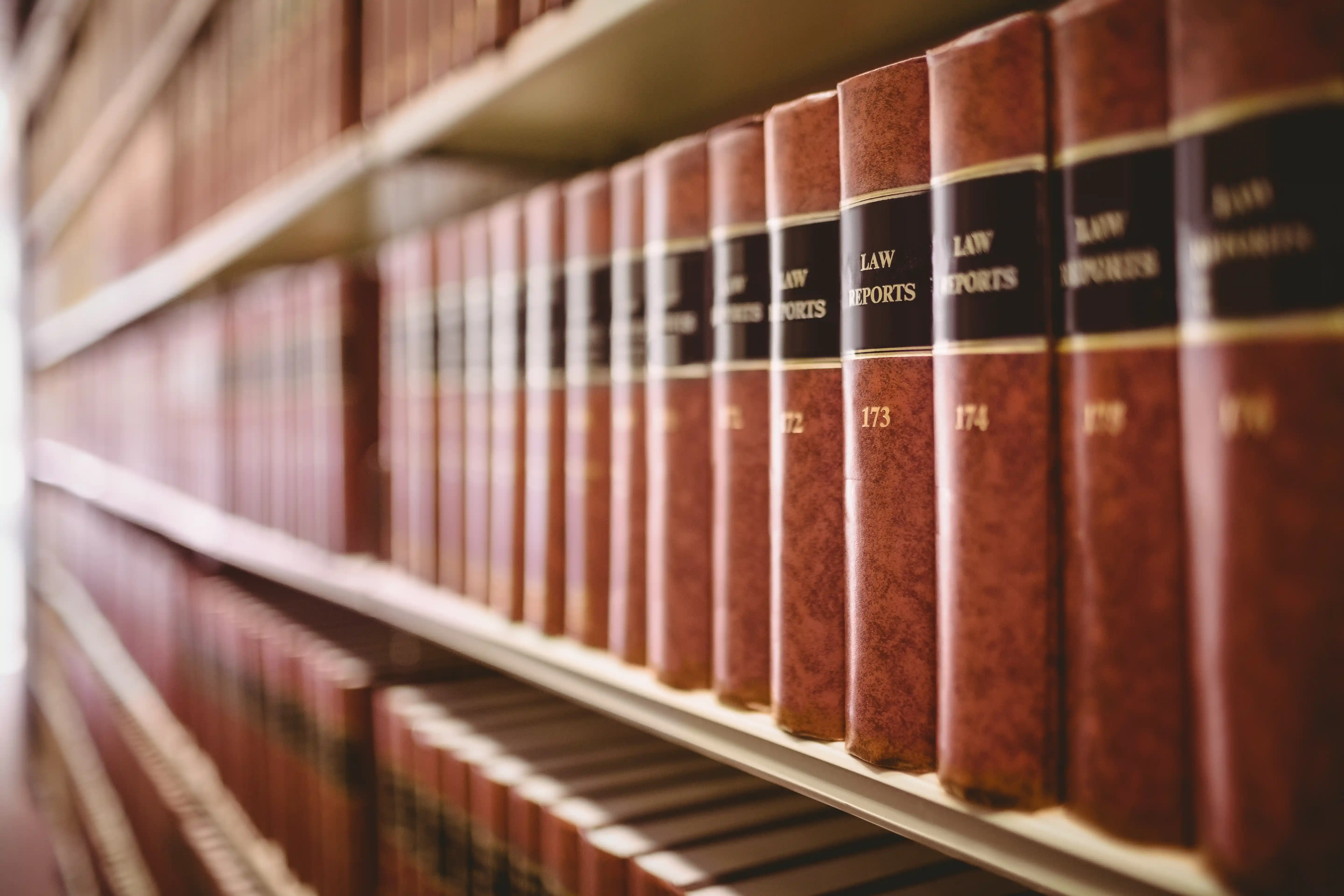 Shelf of bound legal case reports at a law library