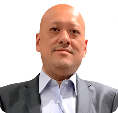 Headshot of Silver Kung in a suit with a white background