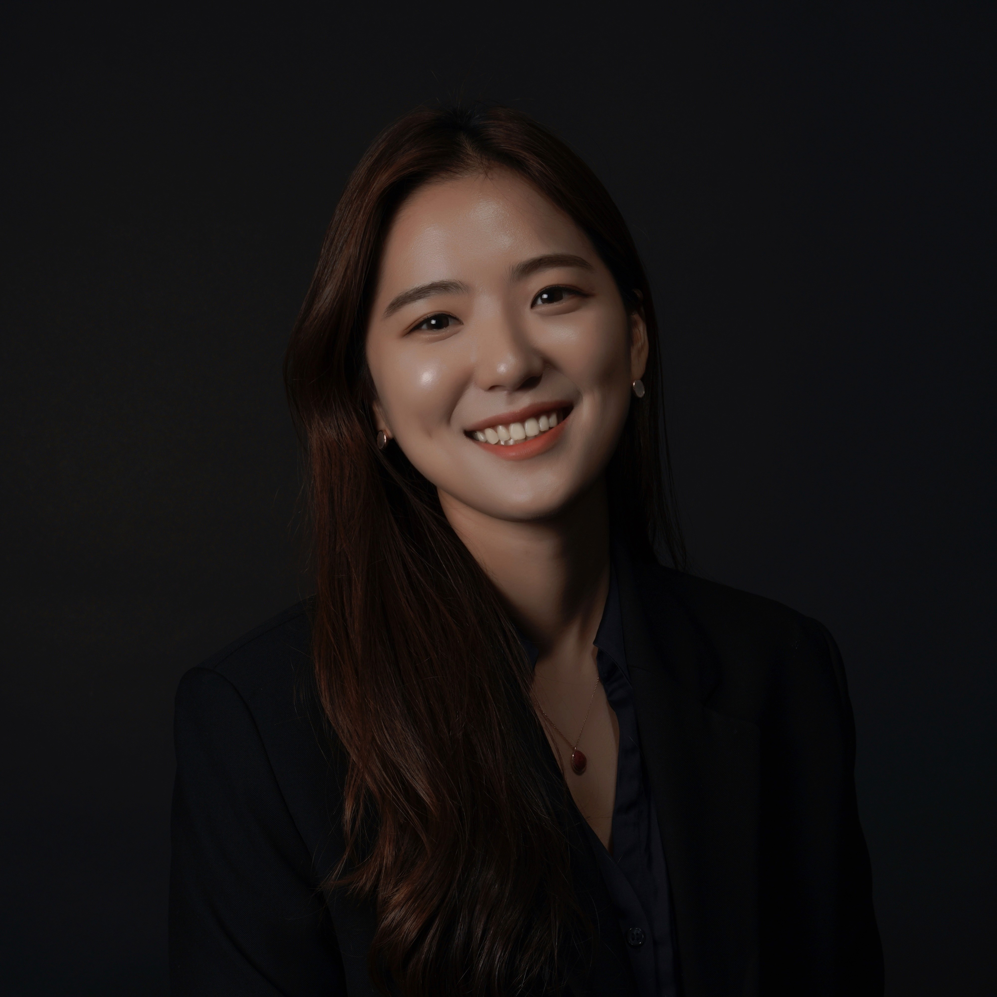 Profile portrait of a man in a white shirt against a light background