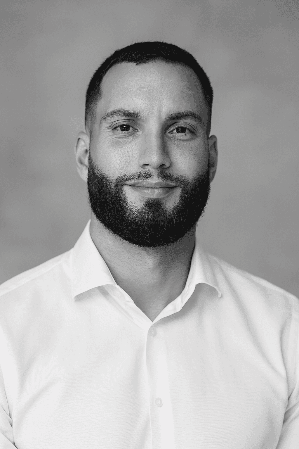 Woman in a stylish orange visor, yellow earrings, and a navy lace top against a blue backdrop. Her expression is poised, with bold red lipstick.