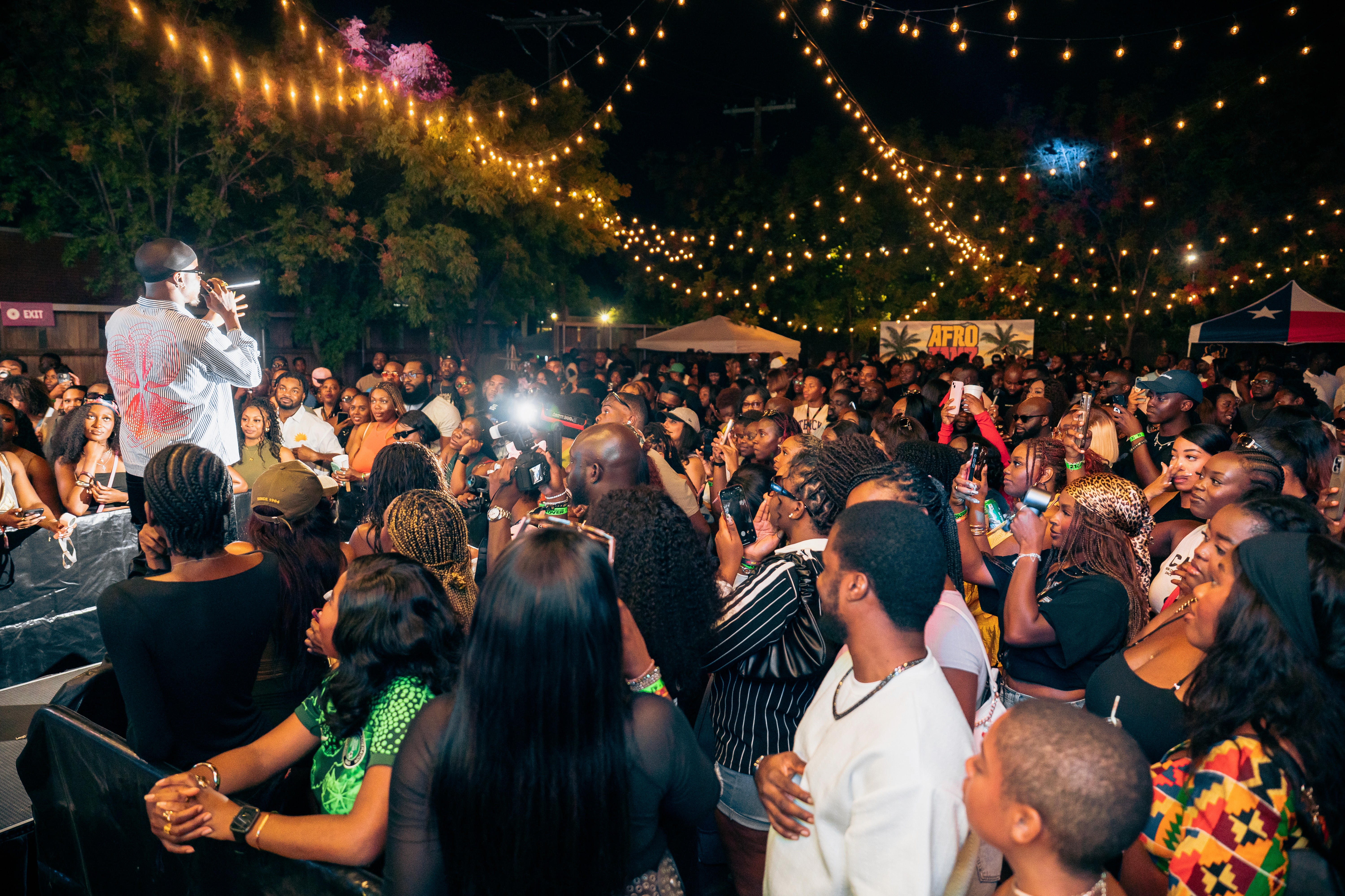 Singer crowd surfing at outdoor concert