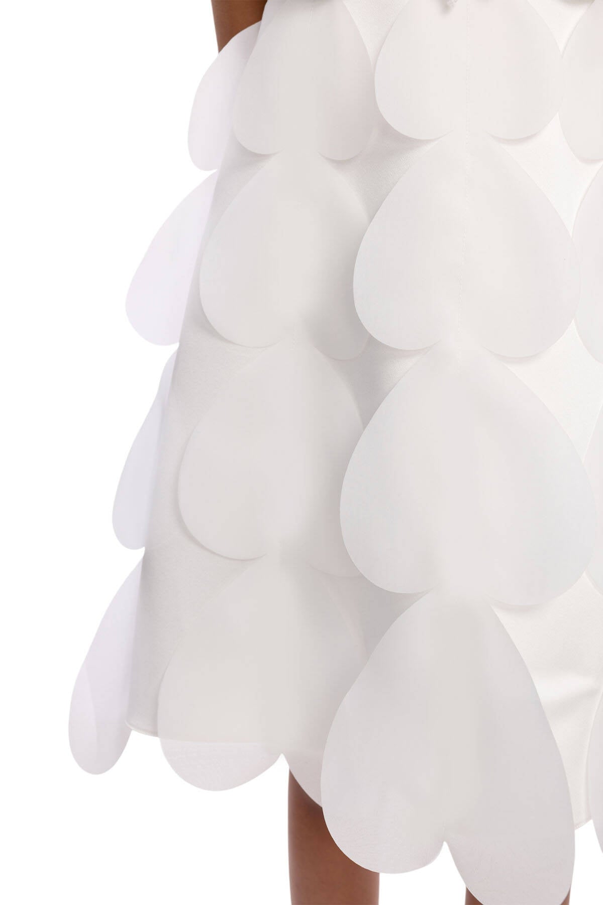 White dress with scalloped edge on a white background