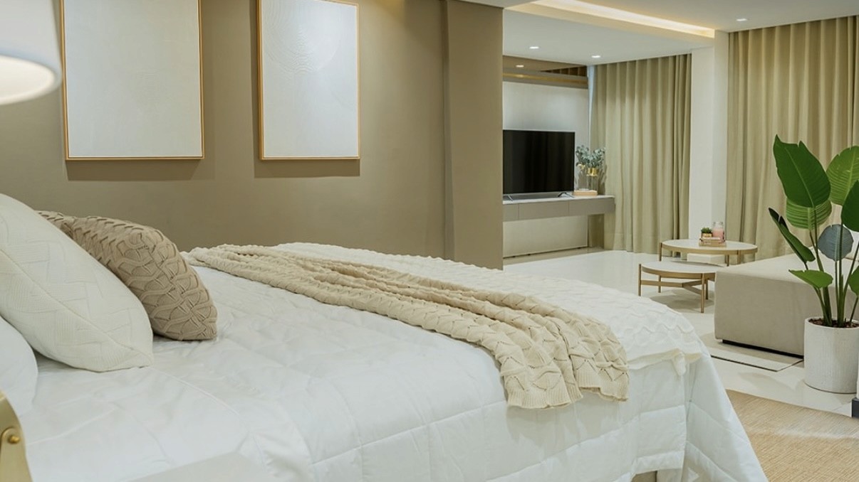 Front view of a modern wooden architecture building on grass with blue sky.
