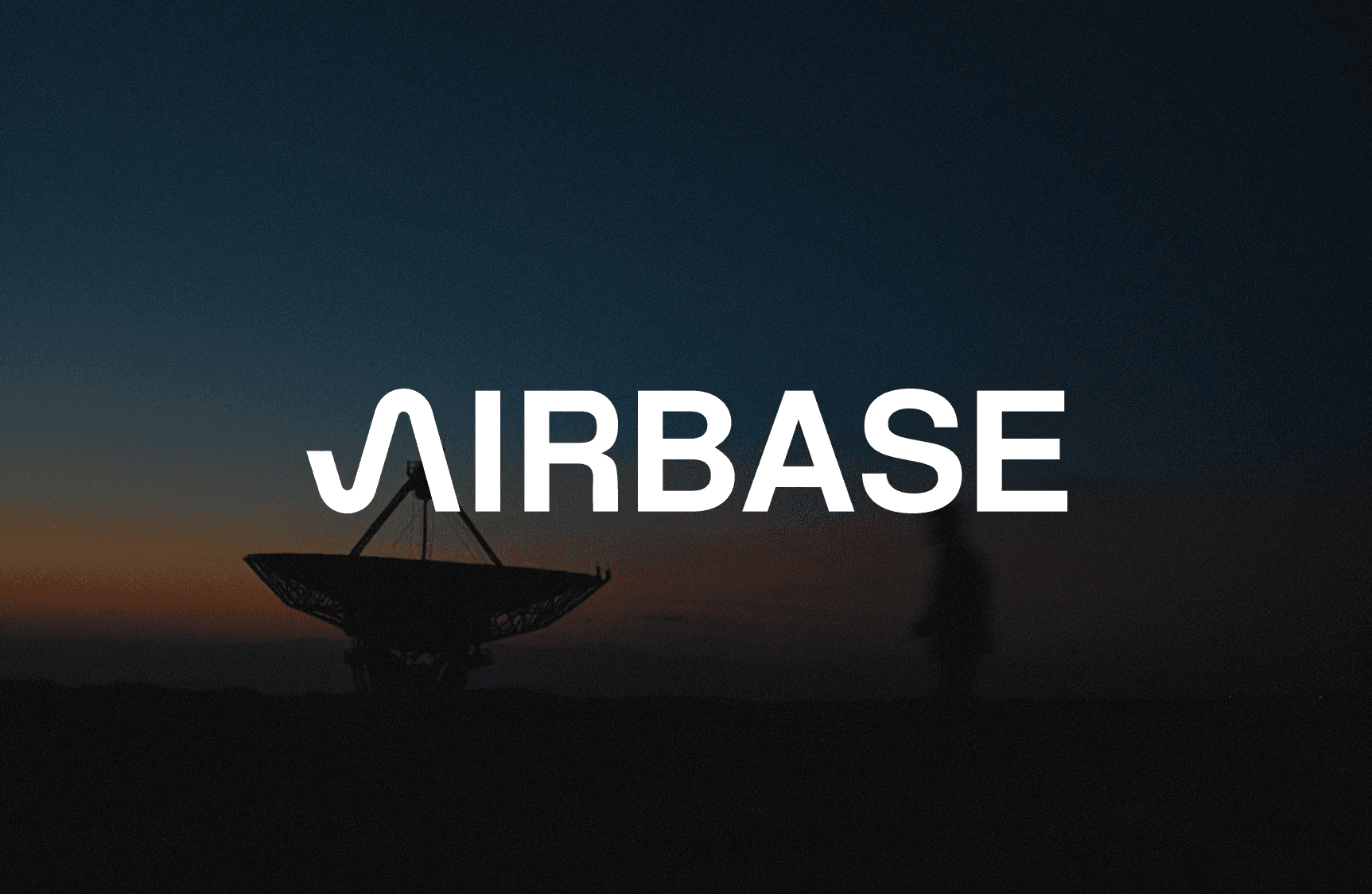 A white wordmark logo that says "Airbase" superimposed over an image of a ground satellite dish and a man walking during sunset.