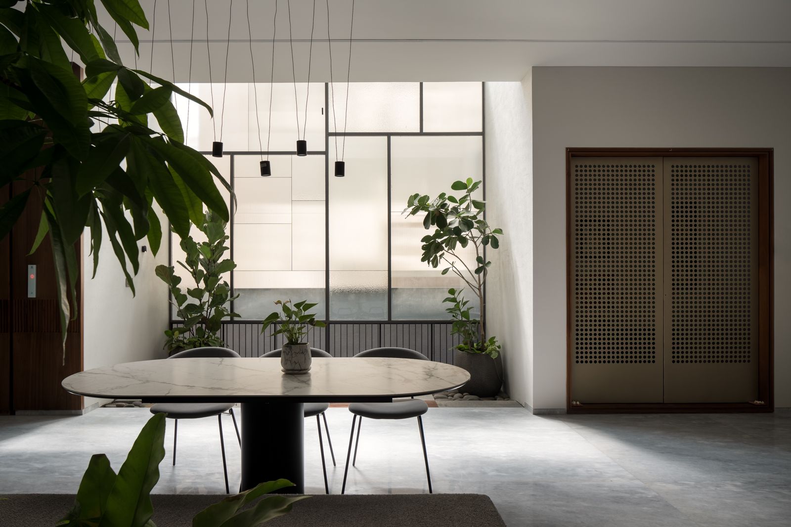 a living room filled with furniture and a wooden floor