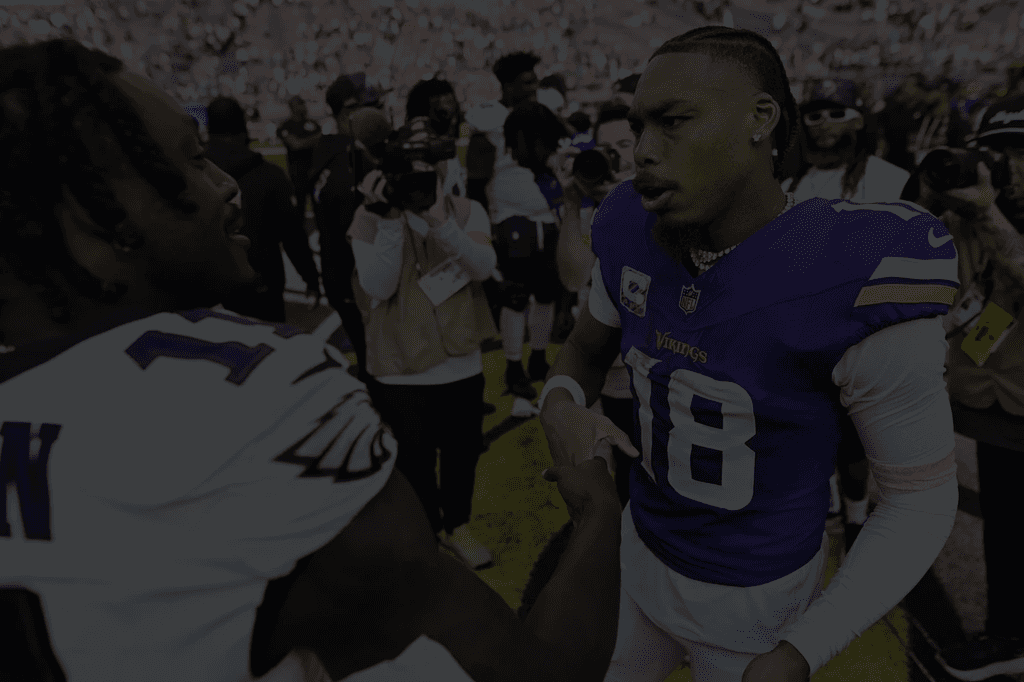 Football players giving a handshake after a game