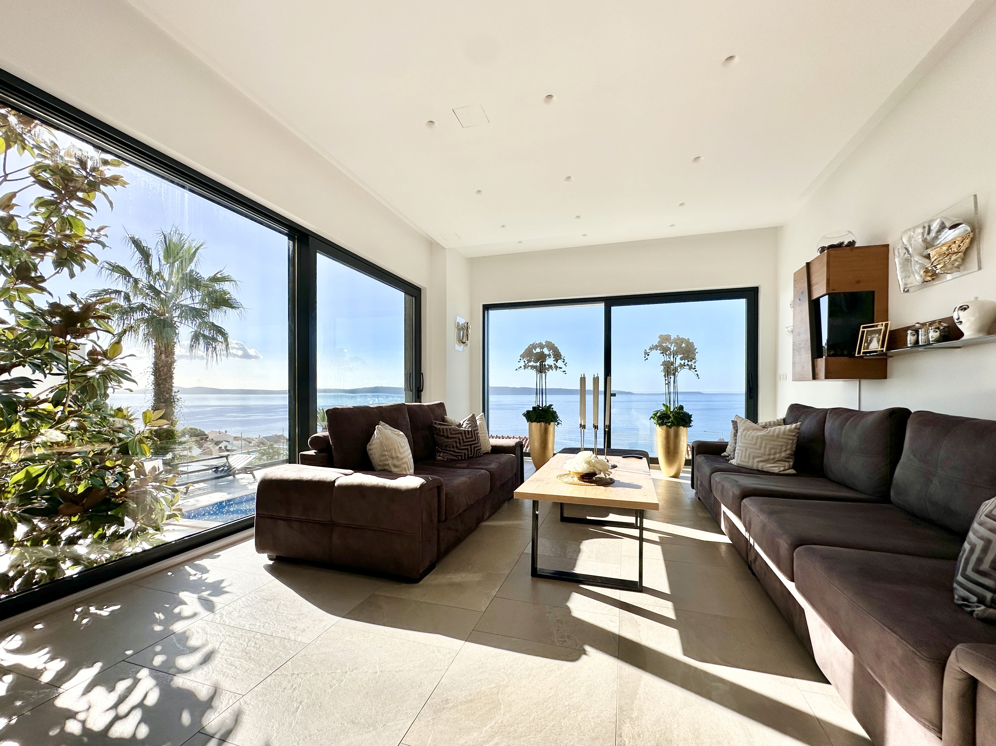 Bedroom with wall bookshelf and mountain view.