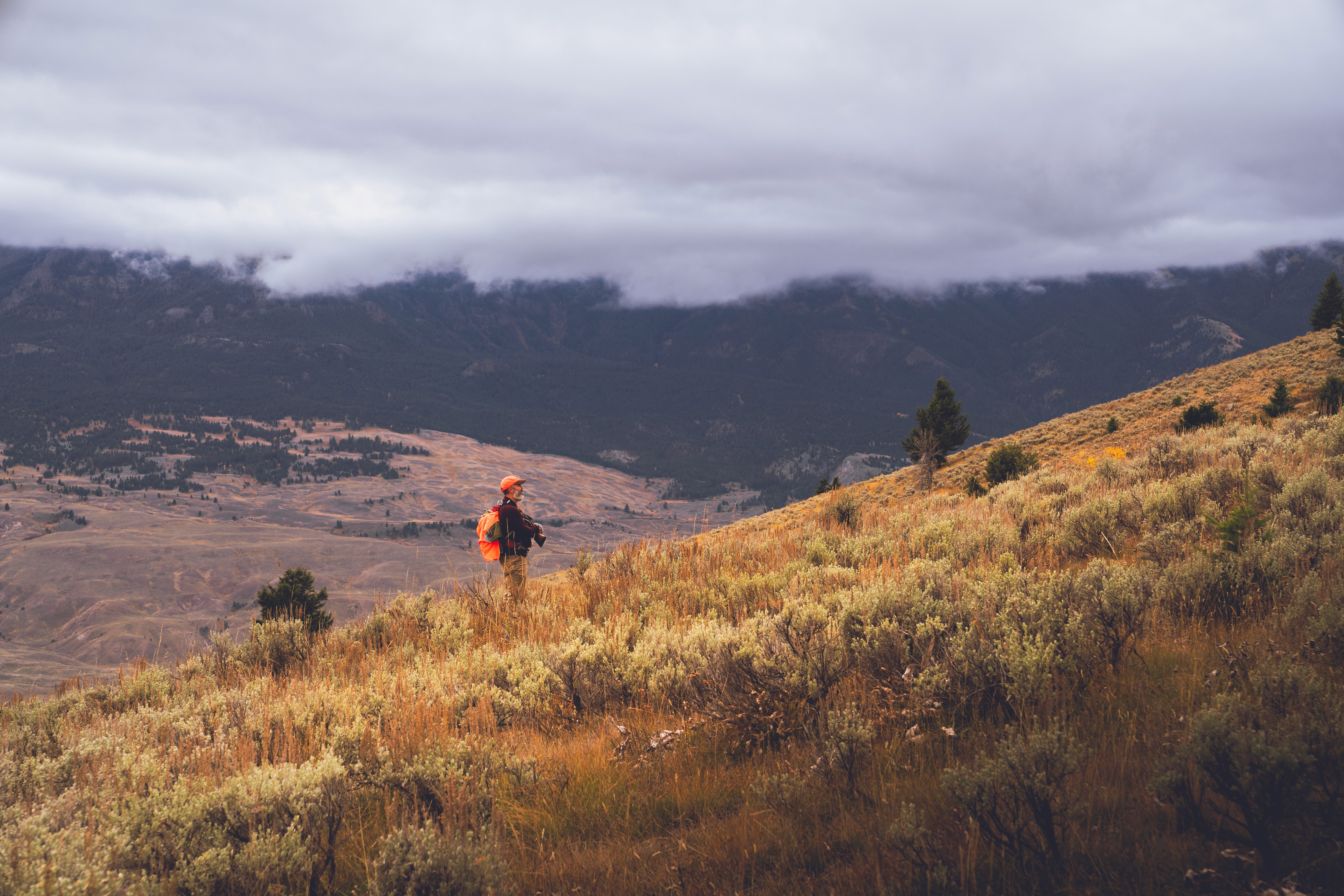 hunter hiking uphill montana