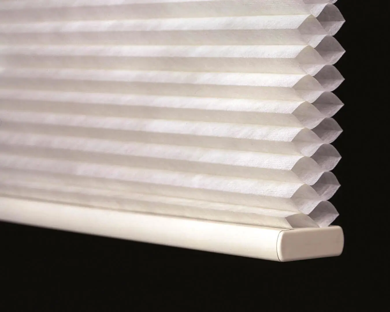 Close up of cellular blinds hanging. Wholesale Blind Factory