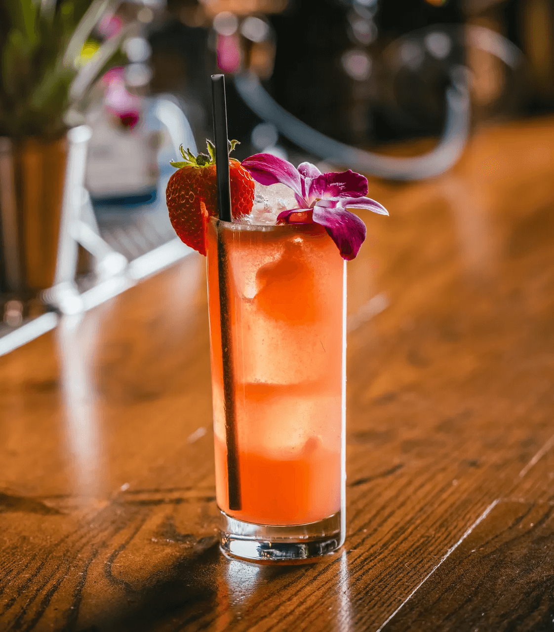 High resolution shot of a beautiful pink cocktail with an orchid