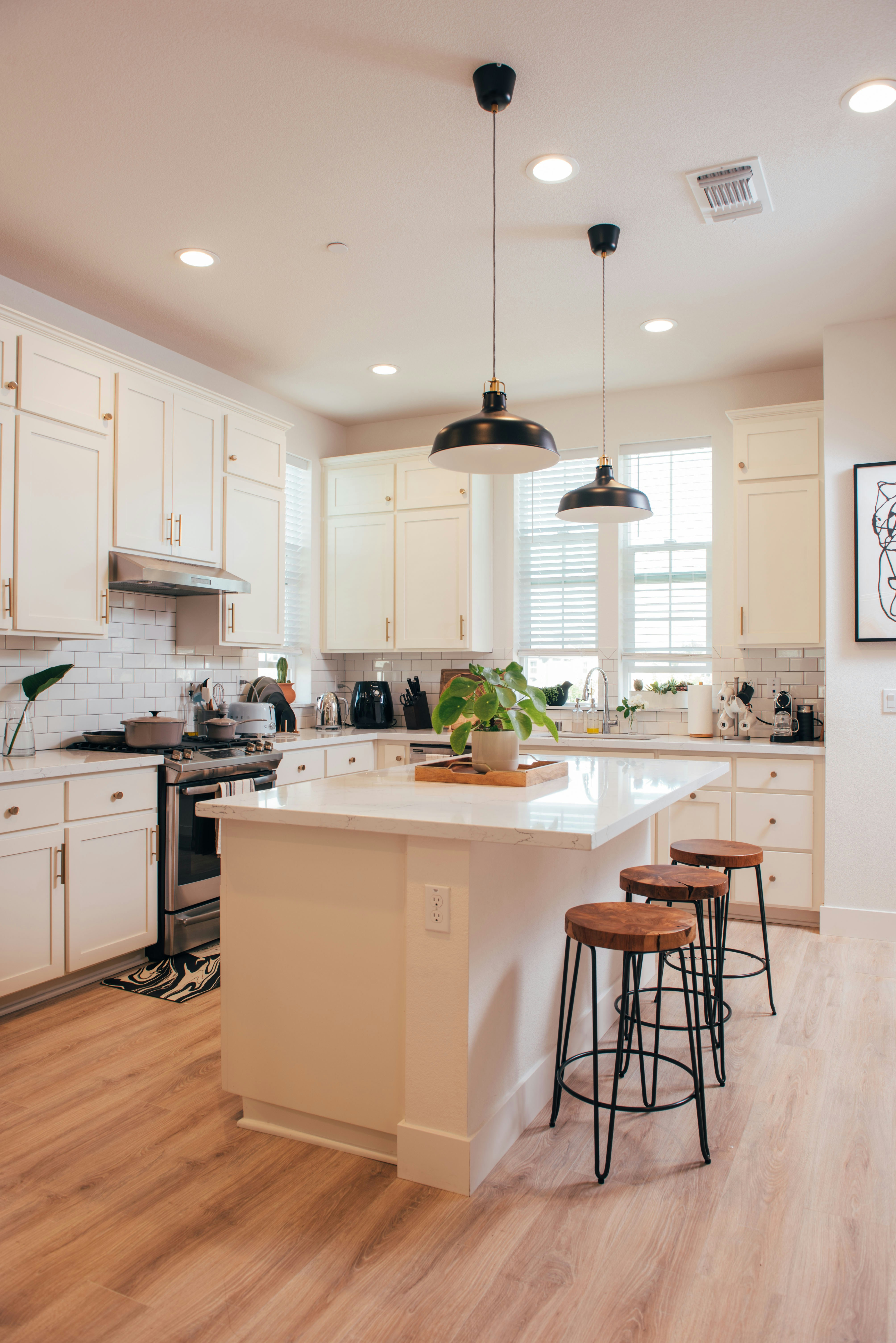 Modern white kitchen with island and bar stools