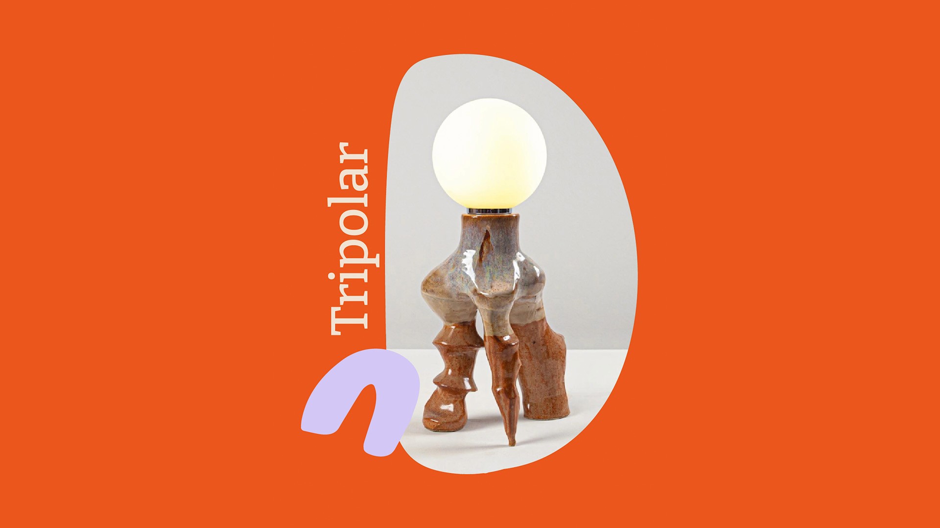 A uniquely sculpted wooden lamp with organic curves and a glowing spherical bulb stands against an orange and gray background, featuring the word "Tripolar" vertically alongside.